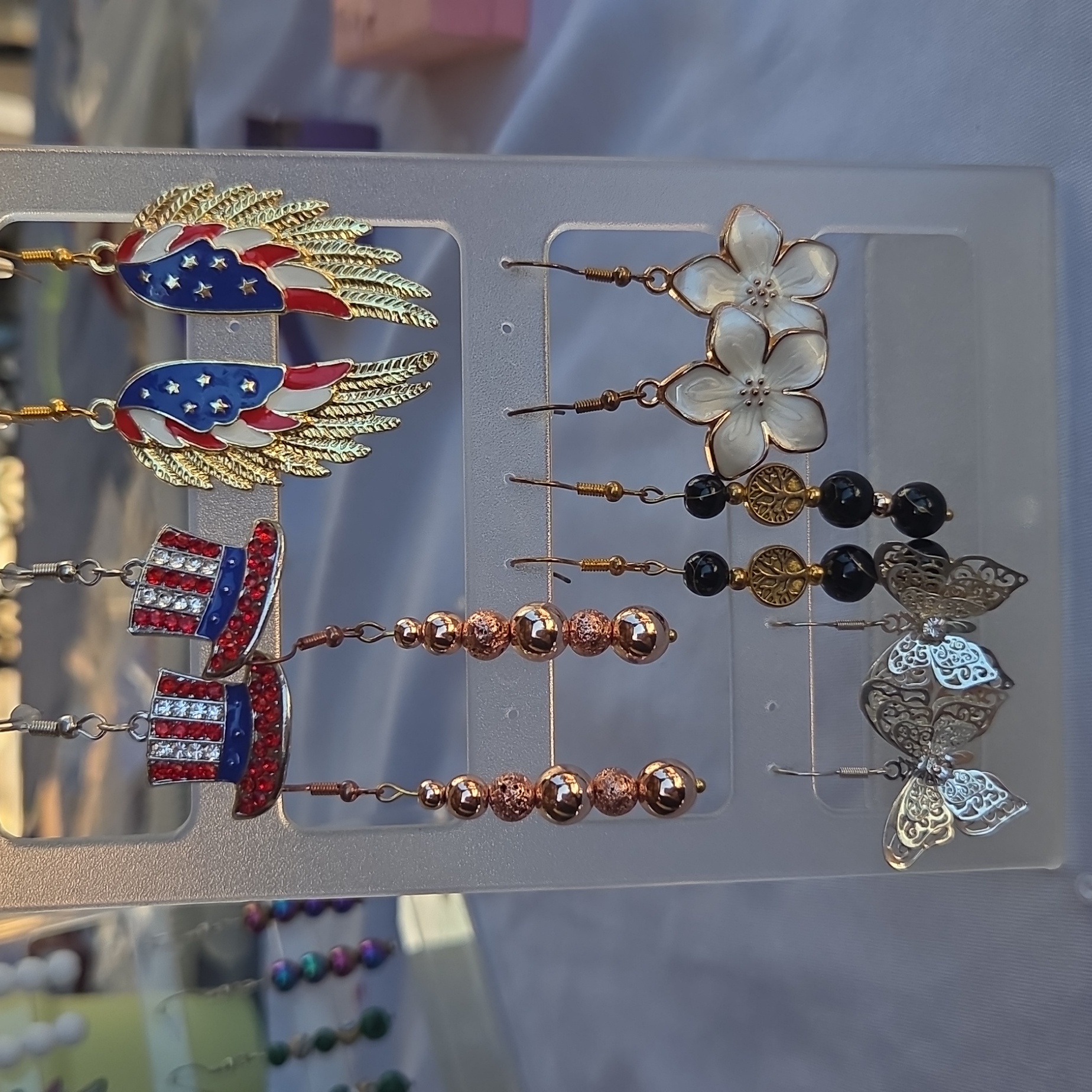 Six Pairs Of Earrings Includes Rack Patriotic Butterflies Flowers 15$